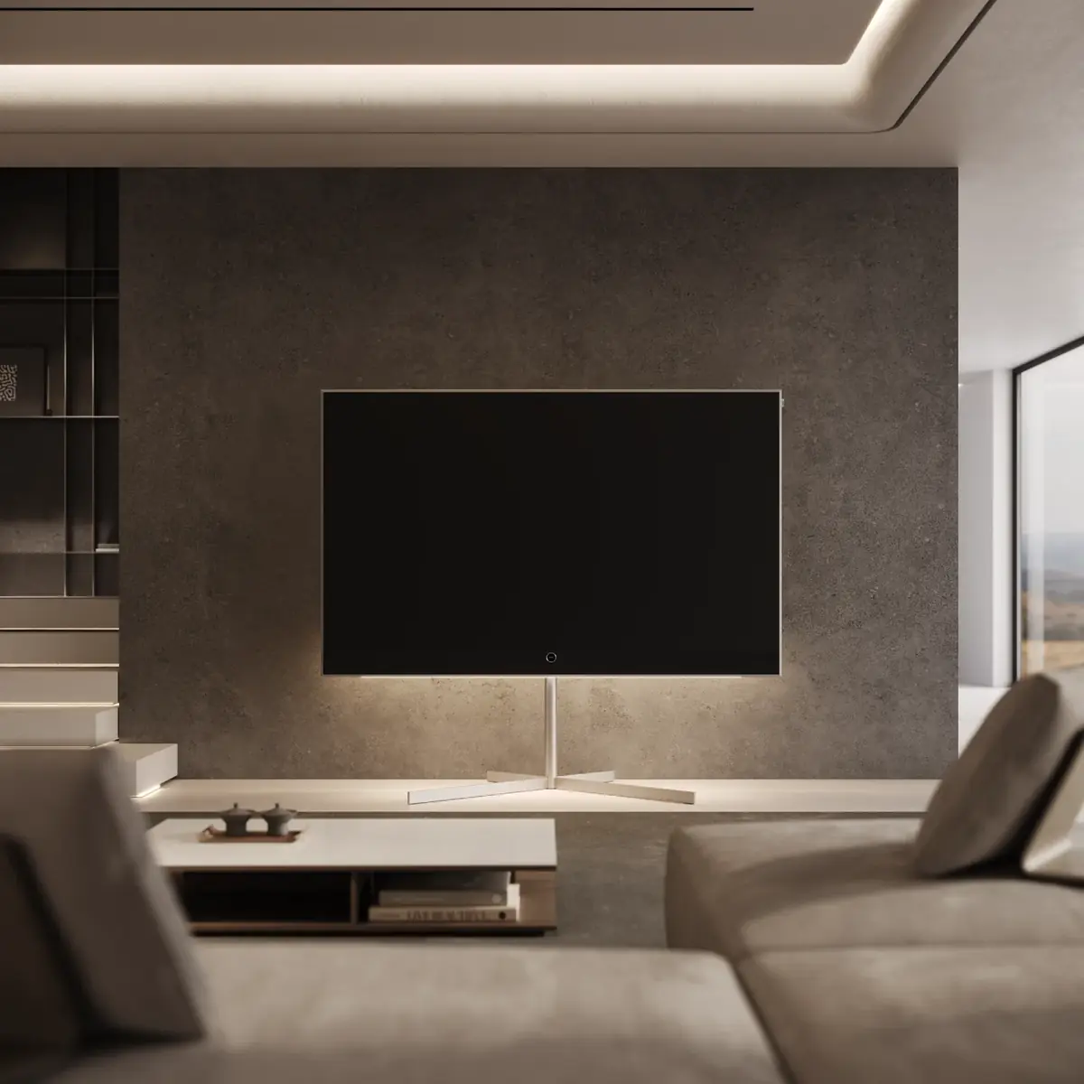 Fernseher an einer dunklen Steinwand mit indirekter Beleuchtung über einem niedrigen Sideboard